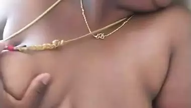 Stepson squeezes his stepmom’s big boob in nude MMS